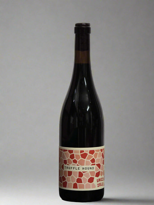 Wine bottle with a decorative label on a gray background