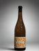 Wine bottle with a label on a gray background